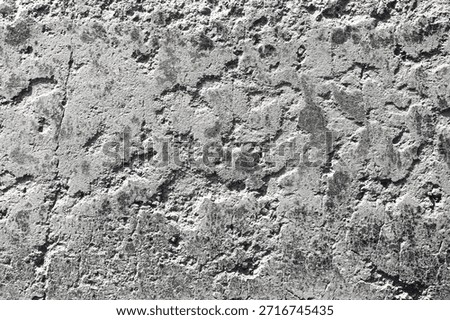 Rough concrete wall texture background. Gray cement surface closeup. Natural stone and plaster pattern. Industrial construction material detail. Weathered solid structure with uneven raw surface.