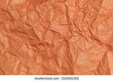 Rough crumpled texture surface of retro old vintage classic grunge paper. Background or backdrop. Design blank. Dark orange, Brown tone