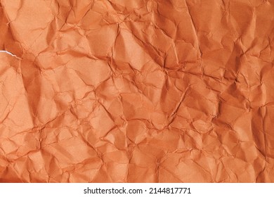 Rough crumpled texture surface of retro old vintage classic grunge paper. Background or backdrop. Design blank. Dark orange, Brown tone