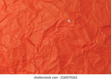 Rough crumpled texture surface of retro old vintage classic grunge paper. Background or backdrop. Design blank. Bright red.