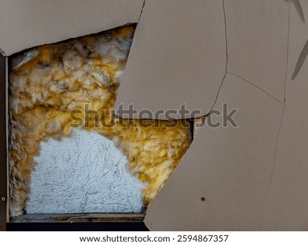 Rough damage to wall cladding with asbestos