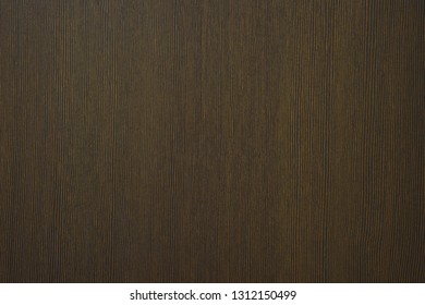 Rough, dark brown surface under the tree, with thin stripes, lines in one direction. - Shutterstock ID 1312150499