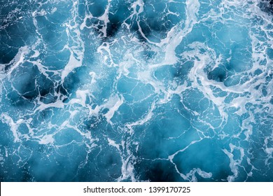 Rough Deep Turquoise And Blue Mediterranean Sea With White Foam Texture Background