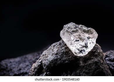Rough diamond, precious stone in mines. Concept of mining and extraction of rare ores.