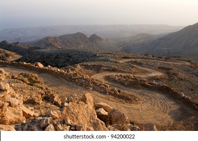 A Rough Dirt Road In Mountains Oman. Sunrise