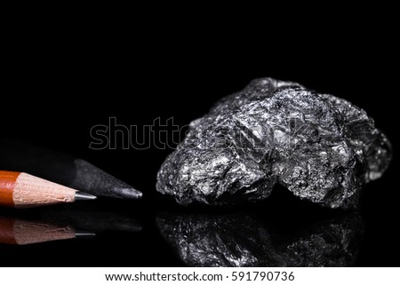 Rough Graphit stone, Pencil leads, black background, reflections