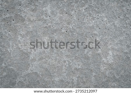 Rough gray concrete wall texture background with natural cement pattern, minimalist urban surface for design, wallpaper, and construction concept