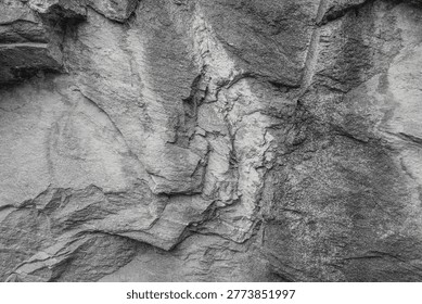 Rough gray rock texture background, natural stone surface with cracks and patterns.
