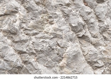 Rough Gray Rock Wall With Jagged Grey Stone Boulder Texture