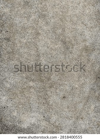 Rough grey concrete surface texture background with gritty details and weathered asphalt feel for industrial design and modern architecture projects.