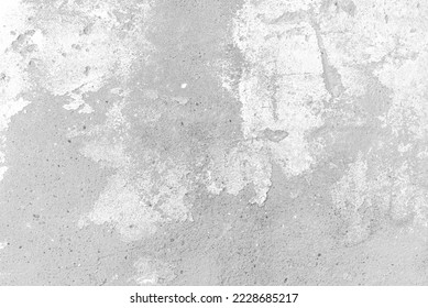A rough and grungy grey white concrete wall structure with imperfect white paint stains.