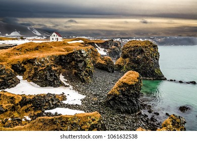 Rough Lava Coastline With Country House In Spring In Snæfellsnes Peninsula, Iceland_