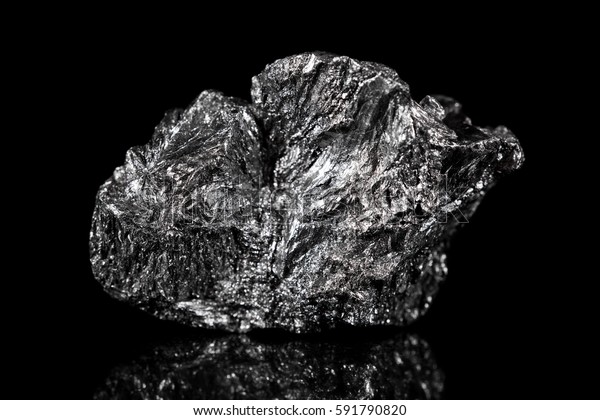Rough mineral stone of Graphite, black\
specimen carbon, black\
background