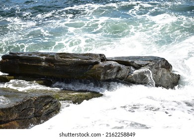 Rough Ocean Water Hitting The Coastal Rocks