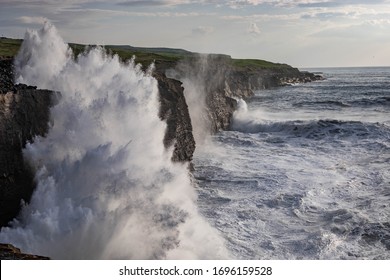 Rough ocean with waves crashing against cliffs in Co. Clare, Ireland - Powered by Shutterstock