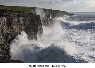 Rough ocean with waves crashing into the rocks - Powered by Shutterstock