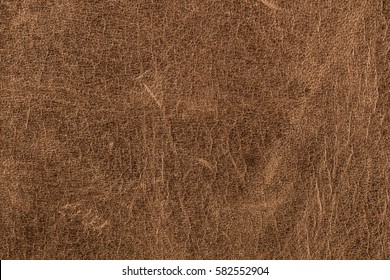 Rough old brown leather background.
