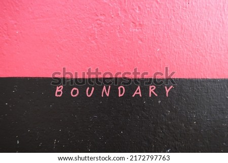 Rough pink black wall background with word BOUNDARY on border, concept of to set limit in relationship which help define what you are comfortable and would like to be treated