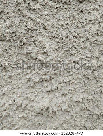 Rough roughcast concrete wall texture close up abstract background for design