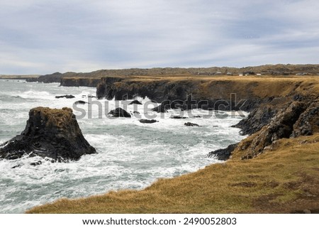 A rough sea bashes the cliffs of Arnarstapi.