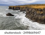 Rough seas along the basalt columns of the Icelandic coastline, as seen from Arnarstapi Viewpoint on the Snaefellsnes Peninsula, western Iceland. Autumn colours.