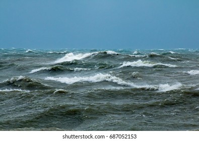 Rough seas with crashing waves in English Channel off Seaford in East Sussex.