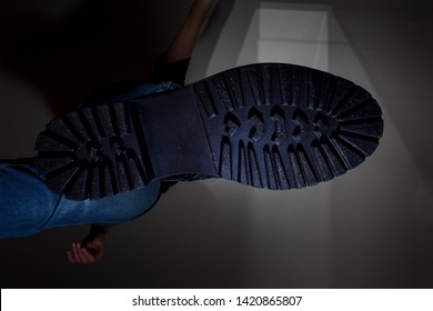 The Rough Sole Of The Shoe, A Bottom View, A Man Coming From The Top, Crush, Dark Background, Man Walking Bottom View