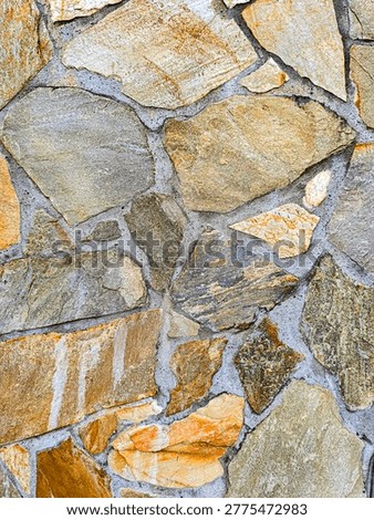 Rough Stone Wall with Irregularly Shaped Rocks and Cement Grout