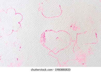 Rough Surface Of Paper Texture With Imprints Of Pink Play Clay In Shape Of Heart And Floral Pattern Made By Toy Molds. Scratched Paper Background With Stains Of Pink Play Dough