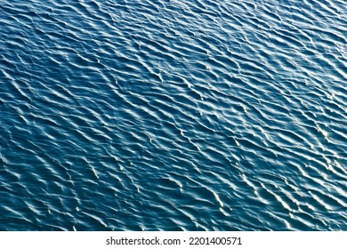 The Rough Surface Of Rippled Wavy Sea Water Illuminated By Daylight