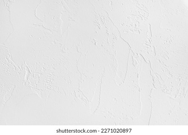 Rough surface of a white painted plastered wall of a living room as a background and copy space