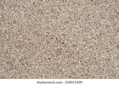 Rough Texture Surface Of Exposed Aggregate Finish, Ground Stone Washed Floor, Made Of Small Sand Stone In Light Brown Color