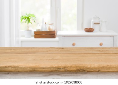 Rough texture table for product display before blurred kitchen window
