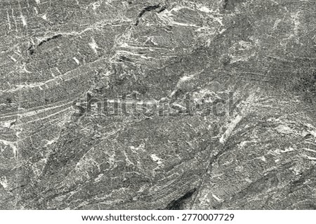 Rough textured gray stone background with natural striations and rugged appearance