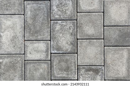 Rough textured surface of large gray paving slabs, close up. Pavement tile pattern, top view - Powered by Shutterstock