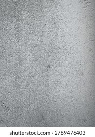 Rough textured surface with a nuanced interplay of shadows and light revealing its inherent robust