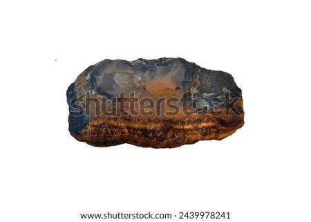 Rough Tiger's eye rock mineral specimen isolated on white background.