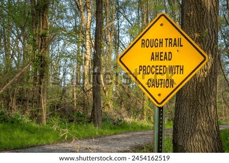 rough trail ahead, proceed with caution - warning sign on Steamboat Trace Trail converted from old railroad near Peru, Nebraska