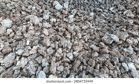 Rough volcanic rock texture background with porous lava stones