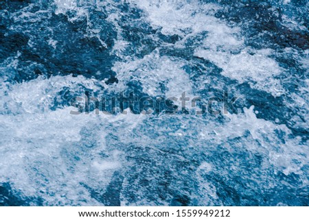Rough water of sea surf. The water boils in rapid flow of river