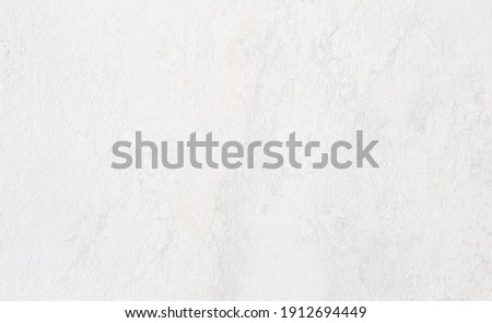 rough white concrete or cement surface background with space for text. architecturural wall or facade background. interior laminated material background.