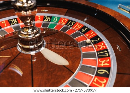 Roulette wheel with ball in motion