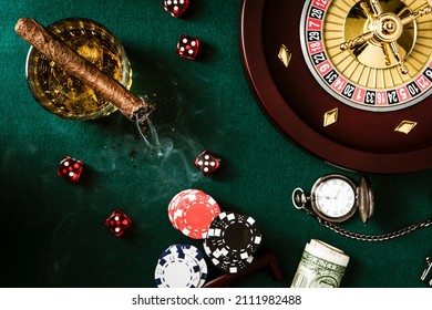 Roulette Wheel, Casino Chips On Poker Table. Top Down View.