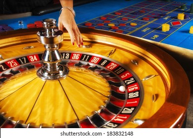 Roulette Wheel And Croupier Hand