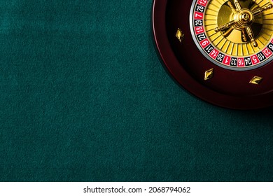 Roulette Wheel On Green Casino Table. Top DOwn View With Copyspace.