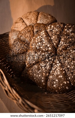 Round barley bread with lighting and brown background