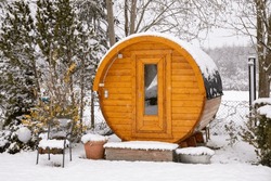 Round Barrel Sauna In The Snow