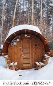 Round Bath Barrel Front View. Wooden Sauna For Summer Cottage Life In The Countryside. Facade Of The House. High Quality Photo