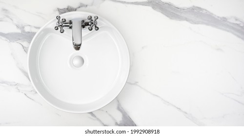 Round bathroom washing sink on marble stone surface, top view - Shutterstock ID 1992908918