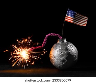 Round black bomb with lit sparking fuse with a US American flag. USA bomb about to detonate symbolizing destruction, threats, or dangerous violence.